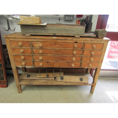 2095 - A victorian pine twelve drawer side unit work bench