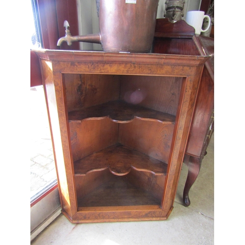 2099 - A Georgian burr walnut and elm corner cupboard