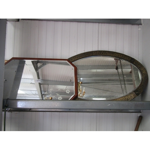 2102 - An Art Deco walnut framed mirror and oval mirror