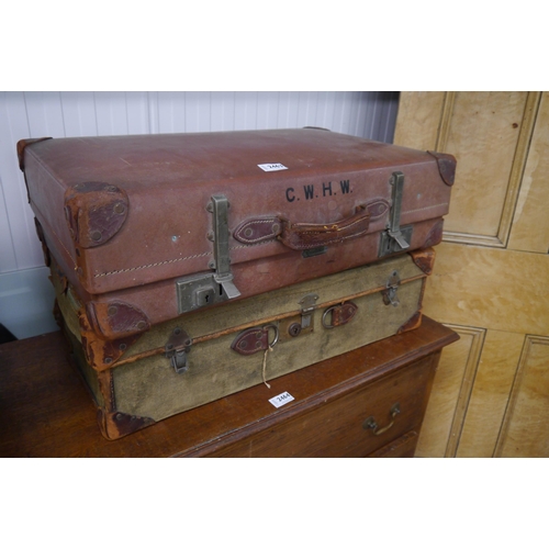 2463 - A vintage canvas suitcase containing Christmas decorations and a 