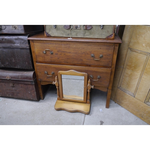 2464 - A 1930's oak chest of two drawers and a pine mirror