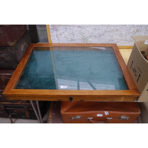 2469 - A large display case 57 x 77cm