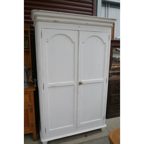 2484 - A painted pine two door wardrobe, W119cm H202cm