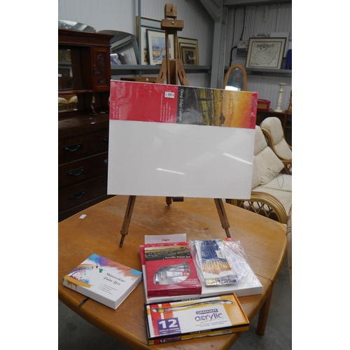 2511 - A selection of artists wares and an easel