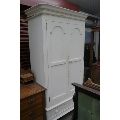 2530 - A painted pine two door wardrobe