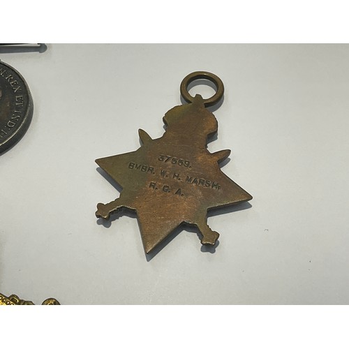 9519 - A WWI 1915 star medal trio named TO 37559 CPL. W.H.G. MARSH R.A. (BMBR R.G.A. to star) together with... 