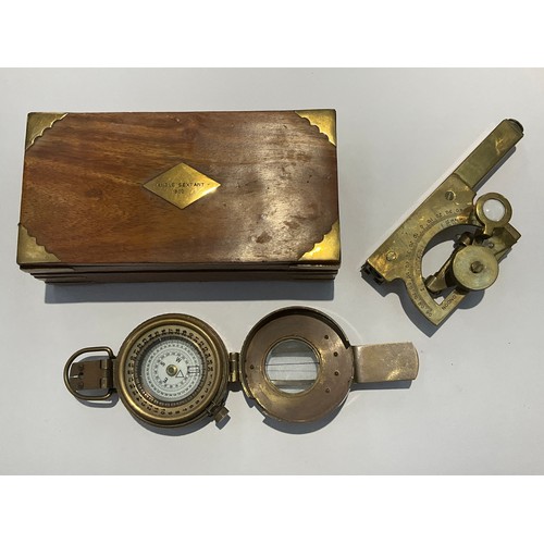 9531 - A reproduction WWII style brass marching compass in the British pattern, together with a reproductio... 