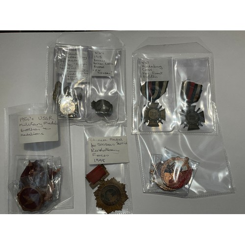 9548 - A collection of mainly British badges and medals including 1914-18 German crosses, Chinese Communist... 