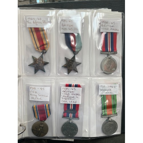 9551 - An album of mixed medals, mainly British WWI and WWII, including two WWI Victory medals to 112817 GN... 