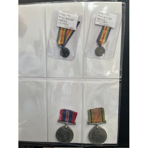 9551 - An album of mixed medals, mainly British WWI and WWII, including two WWI Victory medals to 112817 GN... 