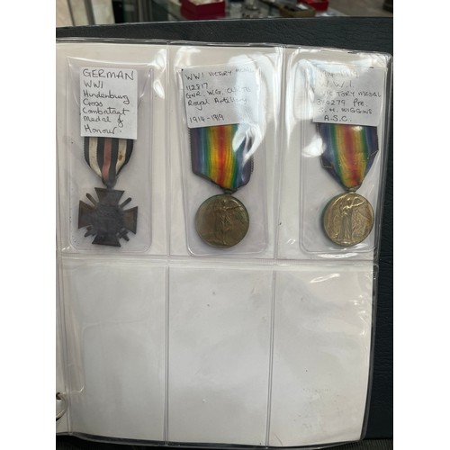 9551 - An album of mixed medals, mainly British WWI and WWII, including two WWI Victory medals to 112817 GN... 