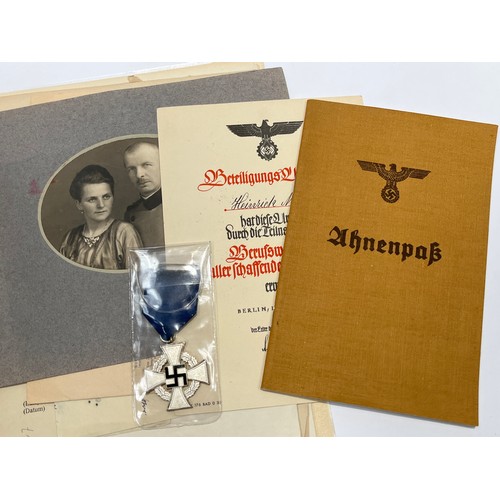 9500 - A WWII German group with 25 Year Faithful Service Medal and award document to Johann Mies, with vari... 