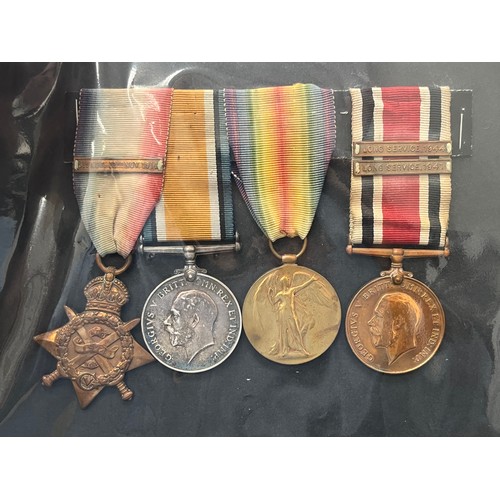 9495 - A WWI and later medal group of four consisting of a Mons Star medal trio with clasp, the star named ... 