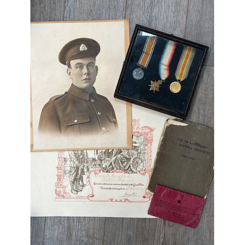 9508 - A WWI 1915 medal trio named to 17093 PTE. H. CLARKE SUFF. R. within a display case, together with di... 