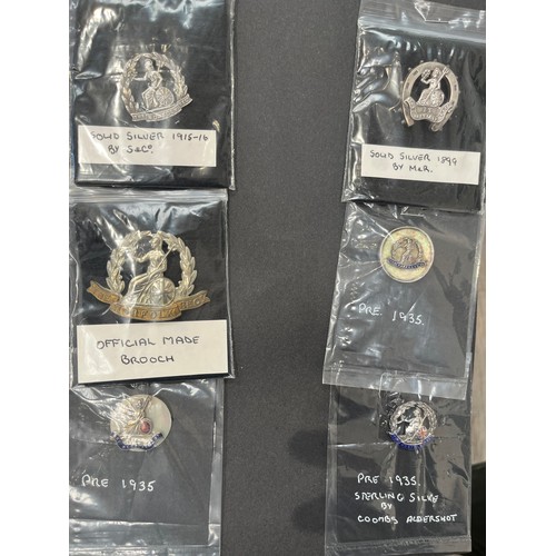 9445 - NORFOLK REGIMENT INTEREST: A collection of six Norfolk Regiment sweetheart badges including official... 