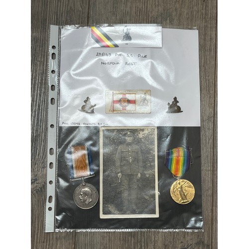 9442 - NORFOLK REGIMENT INTEREST: A pair of WWI medals named to 205143 PTE. S.C. PILE NORF. R. with badges ... 