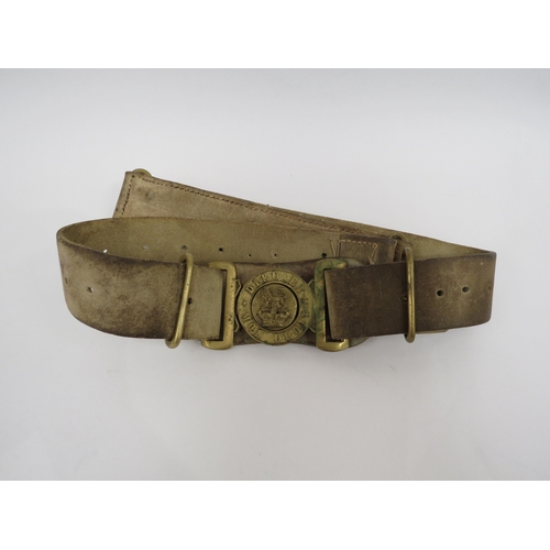 9244 - A Victorian British Army brass waist belt clasp on an original buff white leather belt