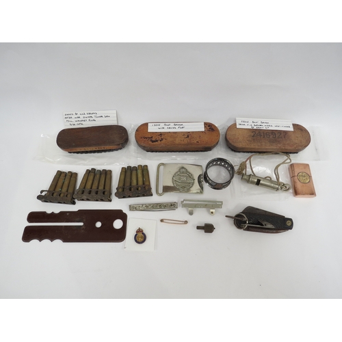 9248 - A collection of various military collectibles including cigarette lighter, belt buckle, Bakelite but... 