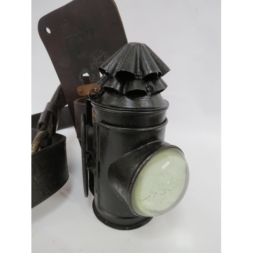 9274 - A WWI 1917 dated police lamp with its leather belt