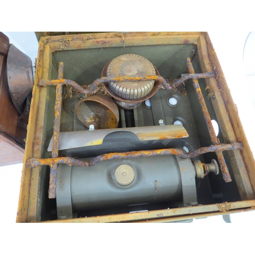 9278 - A leather cased theodolite by Watts & Son, together with a cased military stove (2)