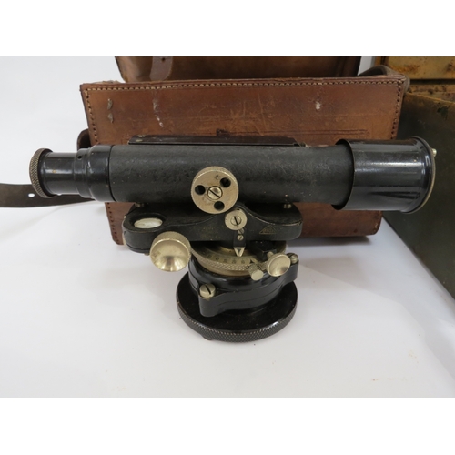 9278 - A leather cased theodolite by Watts & Son, together with a cased military stove (2)