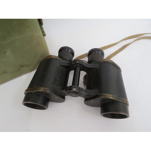 9285 - A pair of WWII 1942 dated Kershaw binoculars with webbing case