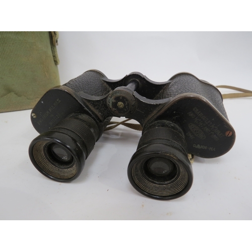 9285 - A pair of WWII 1942 dated Kershaw binoculars with webbing case