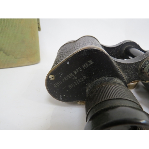 9285 - A pair of WWII 1942 dated Kershaw binoculars with webbing case