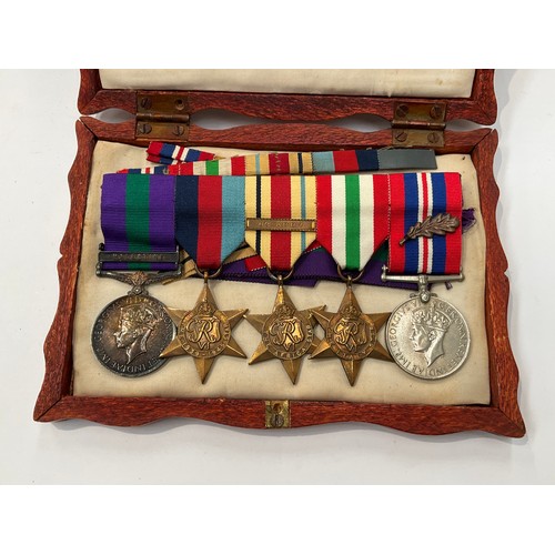 9417 - A WWII and later medal group of five consisting of 1939-45 star, Africa star (with 8th Army clasp), ... 