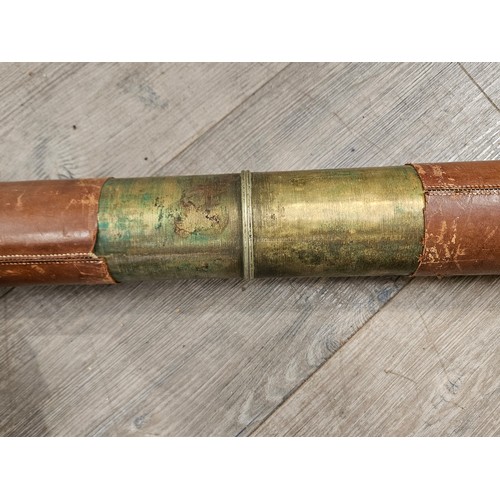 9208 - A Ross of London leather and brass bound telescope of large proportions, approximately 135cm long