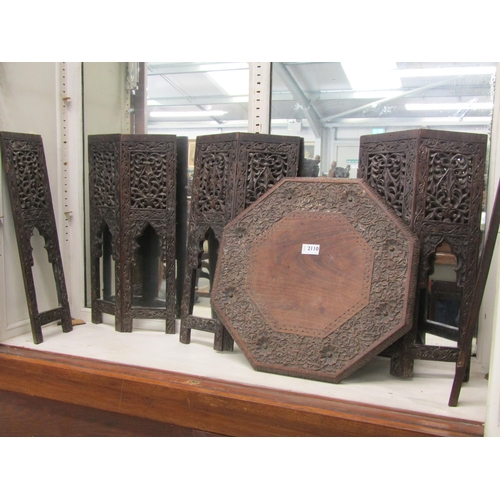 2110 - An early 20th Century Anglo-Indian heavily carved folding occasional table