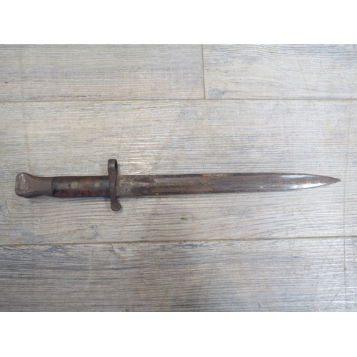 9334 - A British Pattern 1888 Mk. I second type bayonet, with steel-mounted leather scabbard, worn