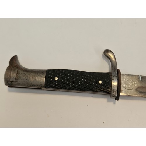 9340 - A WWII German K98 Police bayonet, the blade by Carl Eickhorn, Solingen, black grips, leather frog an... 