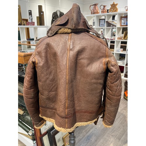 9206 - A WWII British Irvin leather and sheepskin flying jacket, size 6, circa 1940, together with associat... 