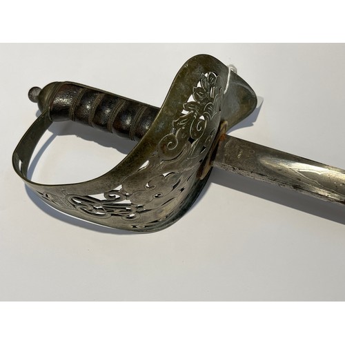 9408 - A George V 1897 pattern officer's sword, pierced basket hilt stamped with 'PRESENTED TO LIEUT. T.C. ... 