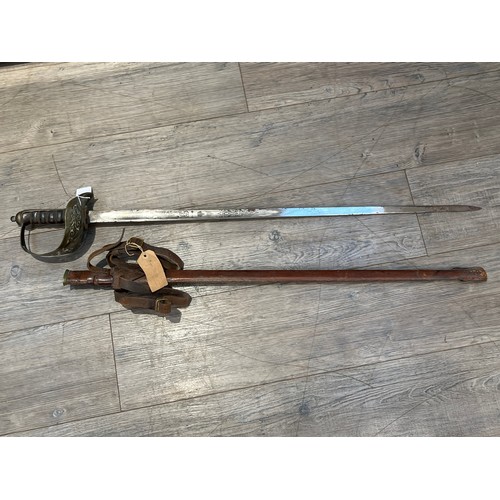 9408 - A George V 1897 pattern officer's sword, pierced basket hilt stamped with 'PRESENTED TO LIEUT. T.C. ... 