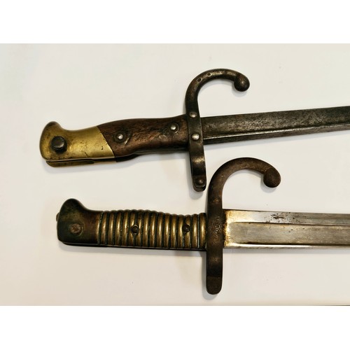 9349 - A 19th Century French Chassepot sabre bayonet with scabbard together with a Gras bayonet, no scabbar... 