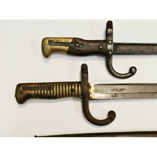 9349 - A 19th Century French Chassepot sabre bayonet with scabbard together with a Gras bayonet, no scabbar... 