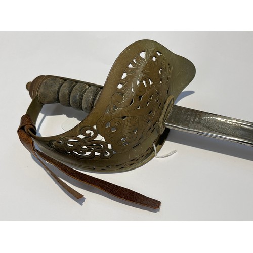 9405 - A George V 1897 pattern officer's sword, pierced basket hilt with cypher and wired shagreen grip joi... 