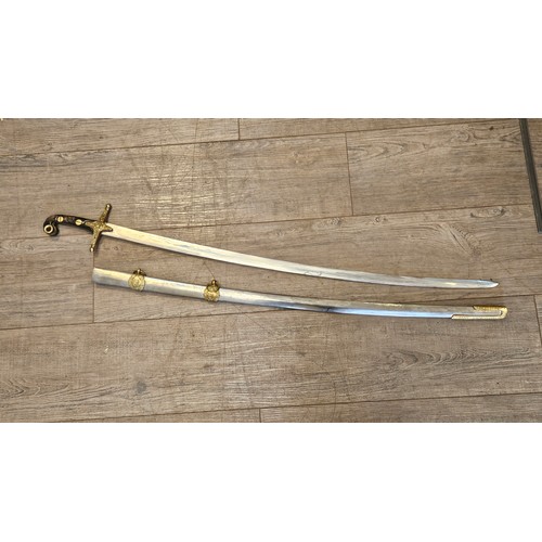 9354 - A reproduction reenactor's Mameluke style sword, brass and steel scabbard, grip a/f