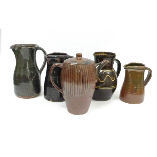 7127 - A collection of studio pottery jugs and a coffee pot from Winchcombe, Lowerdown etc, some a/f. Talle... 