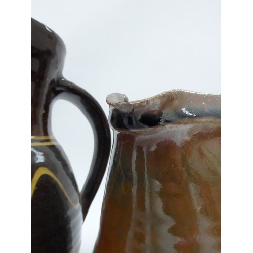 7127 - A collection of studio pottery jugs and a coffee pot from Winchcombe, Lowerdown etc, some a/f. Talle... 