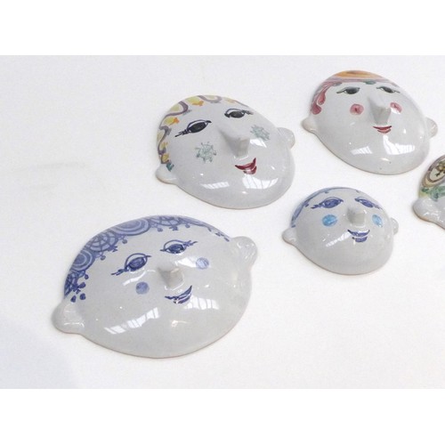 7195 - BJORN WIINBLAD (Danish 1918-2006) Five pottery face mask wall plaques, hand painted in colours.  Pai... 