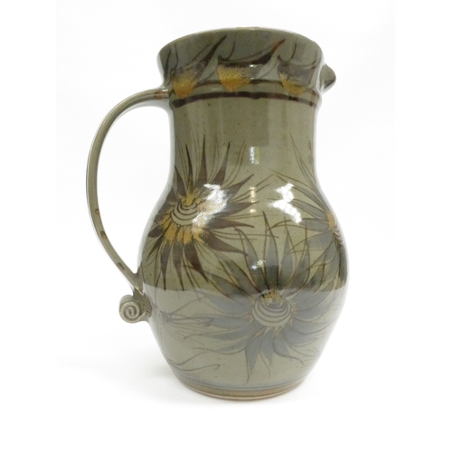 7111 - An Eeles Pottery large jug with painted foliate detail. Unmarked. 32cm high plus - A pair of studio ... 