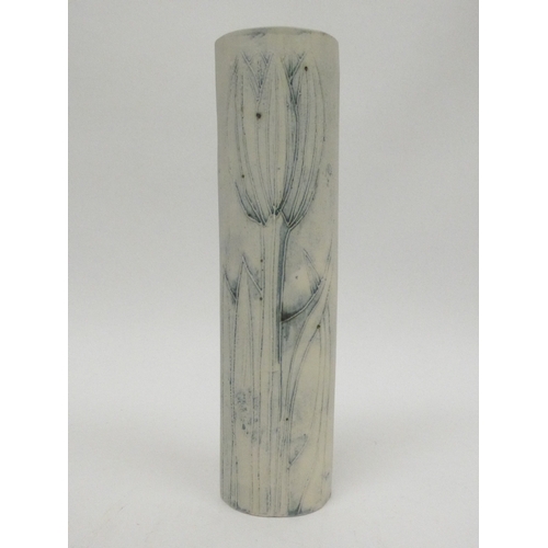 7122 - A Carn Pottery of Cornwall tall vase with relief moulded flower detail. 26.5cm high