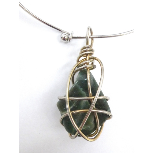 7342 - A 1970's large caged Aventurine stone pendant on torc necklace