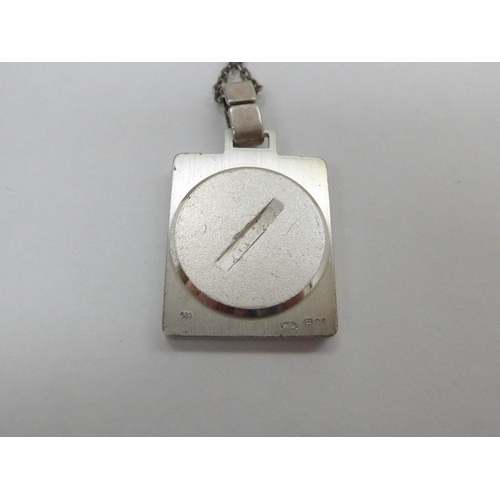 7339 - A 1970's S.O.S silver pendant on silver chain with screw back chamber. Import 925 silver marks and m... 