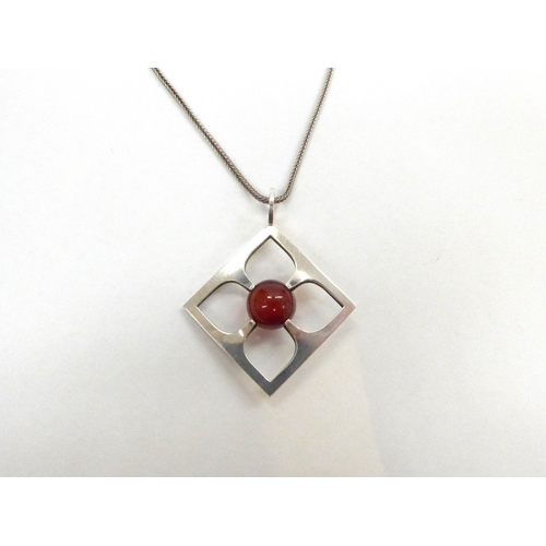 7338 - A Mid Century Finnish silver pendant and chain featuring a suspended carnelian orb centre stone, by ... 