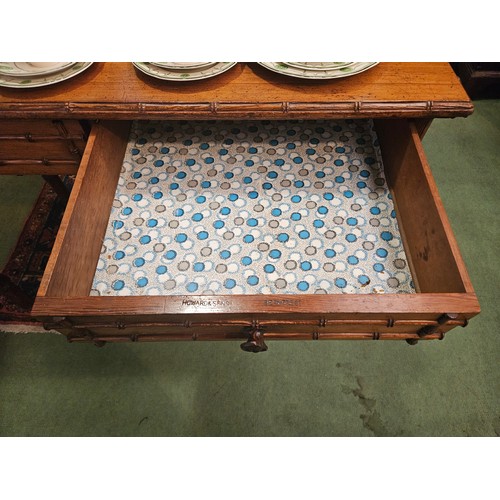 4070 - A Victorian Howard & Sons, Berners St. two drawer bamboo effect side table, marked to drawer, missin... 