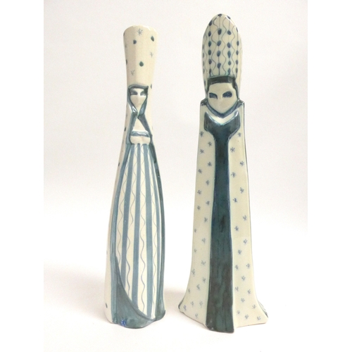 7080 - Two Rye Pottery figures by David Sharp - Queen (chip to base) and Bishop. Both painted in blue and p... 